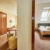 Holidays Club Resorts - Négyfős emeleti apartman - nappali és hálószoba